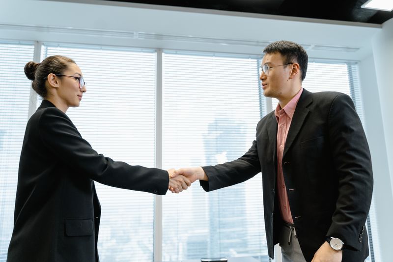 Two professionals making a business connection. Stock photography.
